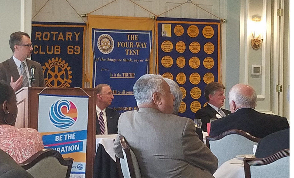 A professor speaks to a rotary club