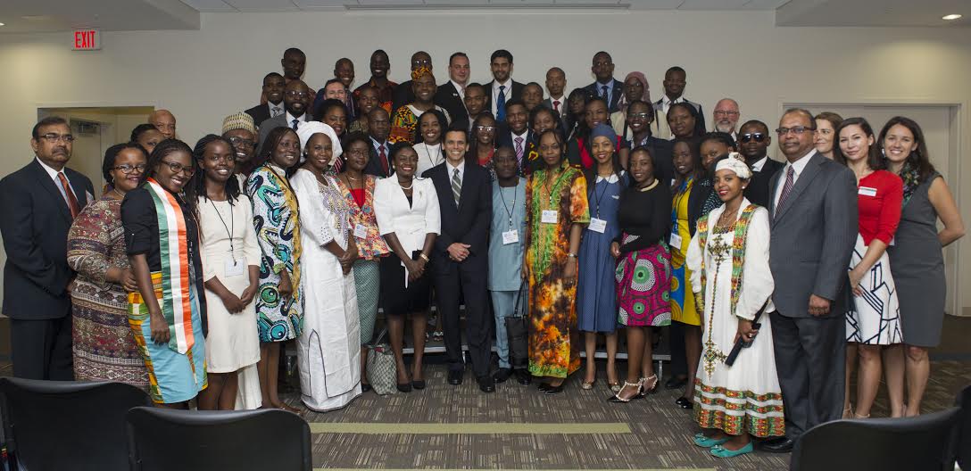 Group image of 25 Mandela Washington fellows, VCU president Michael Rao, Ph.D., and Wilder School Dean, Niraj Verma, Ph.D.