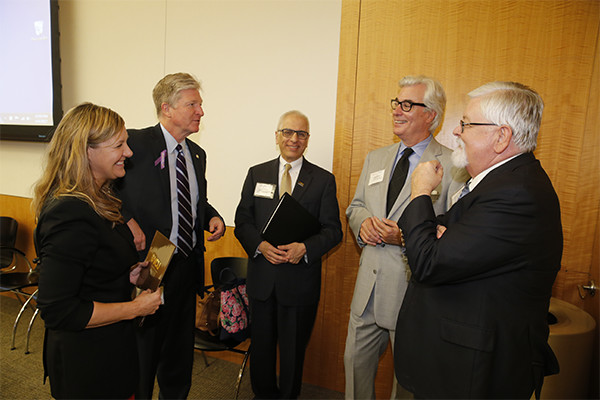 First: (from left) Robyn McDougle, Virginia Secretary of Public Safety and Homeland Security Brian Moran, Wilder School Dean John Accordino, Greg Wingfield and David Hudgins of Old Dominion Electric Cooperative.
Second: Virginia FREE Executive Director Chris Saxman gives opening remarks.
Third: Wilder School Dean John Accordino and Robyn McDougle greet Del. Kenneth Plum of Reston.