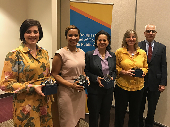 Wilder School Dean John Accordino, Ph.D. with (from left), Hayley Cleary, Ph.D., Criminal Justice, Excellence in Scholarship; Shajuana Isom-Payne, director of student success, Professionalism Award; Susan Gooden, Ph.D., Public Administration, Excellence in Mentoring; and Maureen Moslow-Benway, HSEP. Not pictured, Mark Christie, Public Policy and Administration, Distinguished Adjunct award.