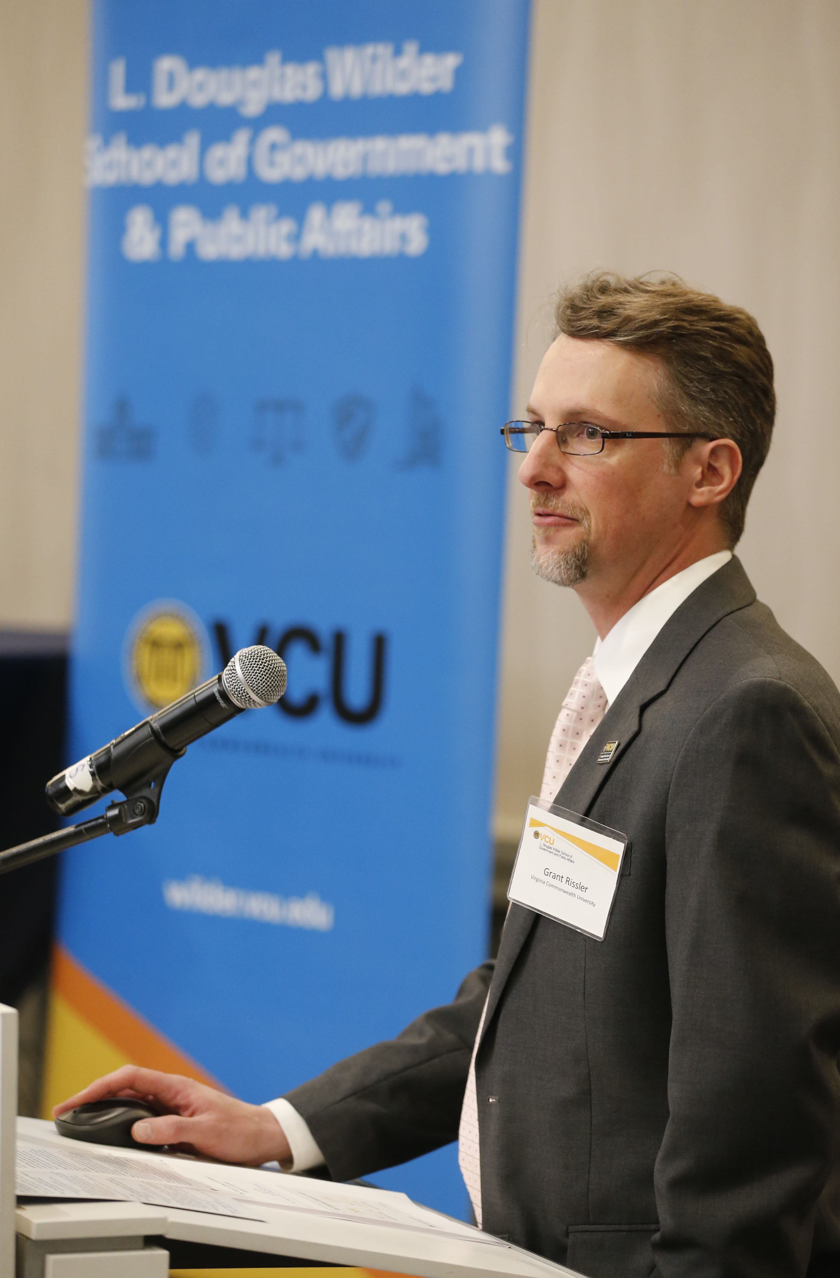  Dr. Grant Rissler of the Wilder School’s Center for Public Policy gives an overview of the 2017 Summer Public Policy Poll at the Forum on School Safety in the Commonwealth.