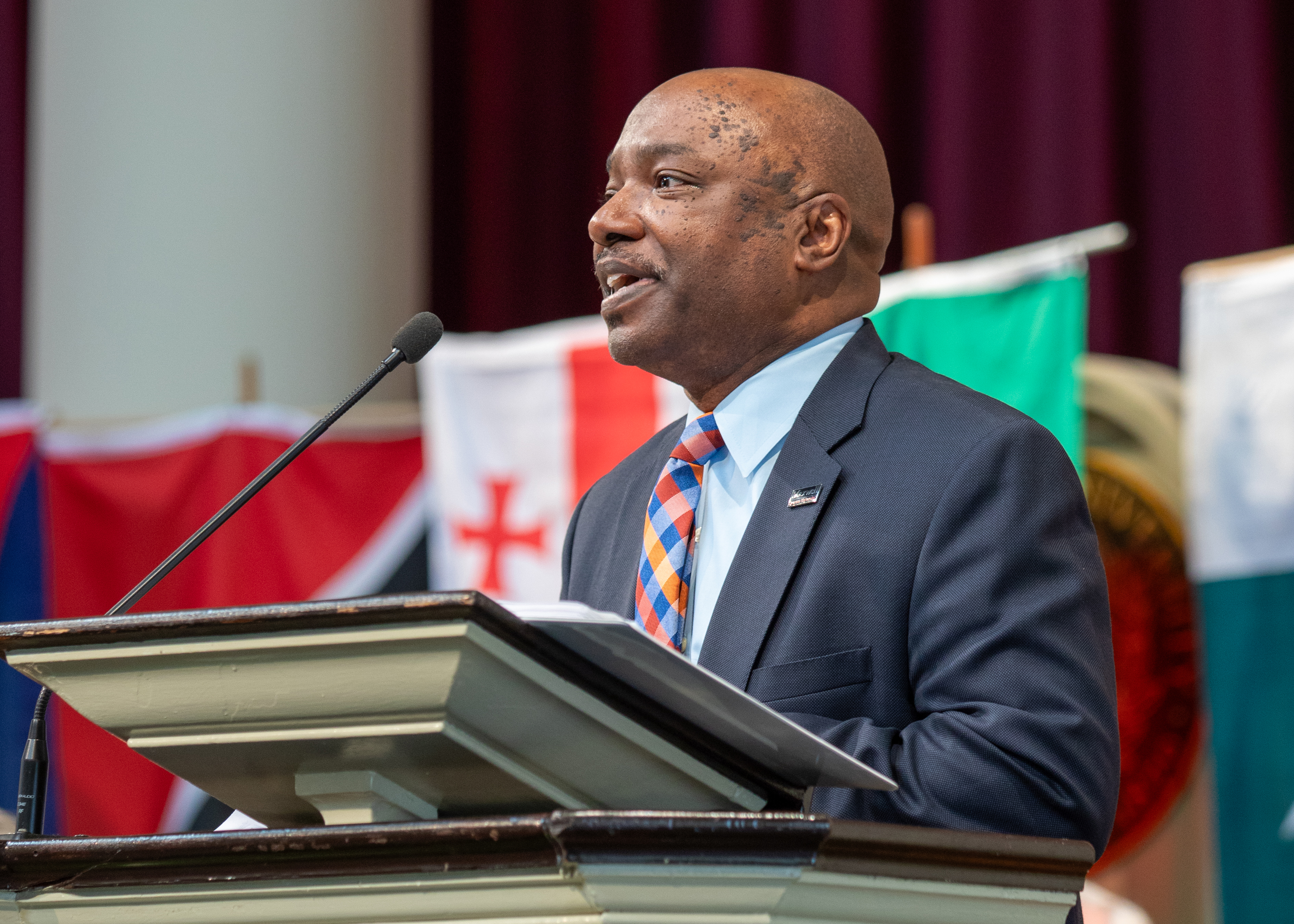 Eric Campbell leading students in the Athenian Oath during a convocation ceremony honoring MPA students at Syracuse University's Maxwell School. The oath's guiding principle, 