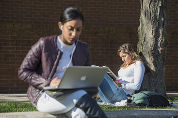 Students reading in VCU's Park Plaza.