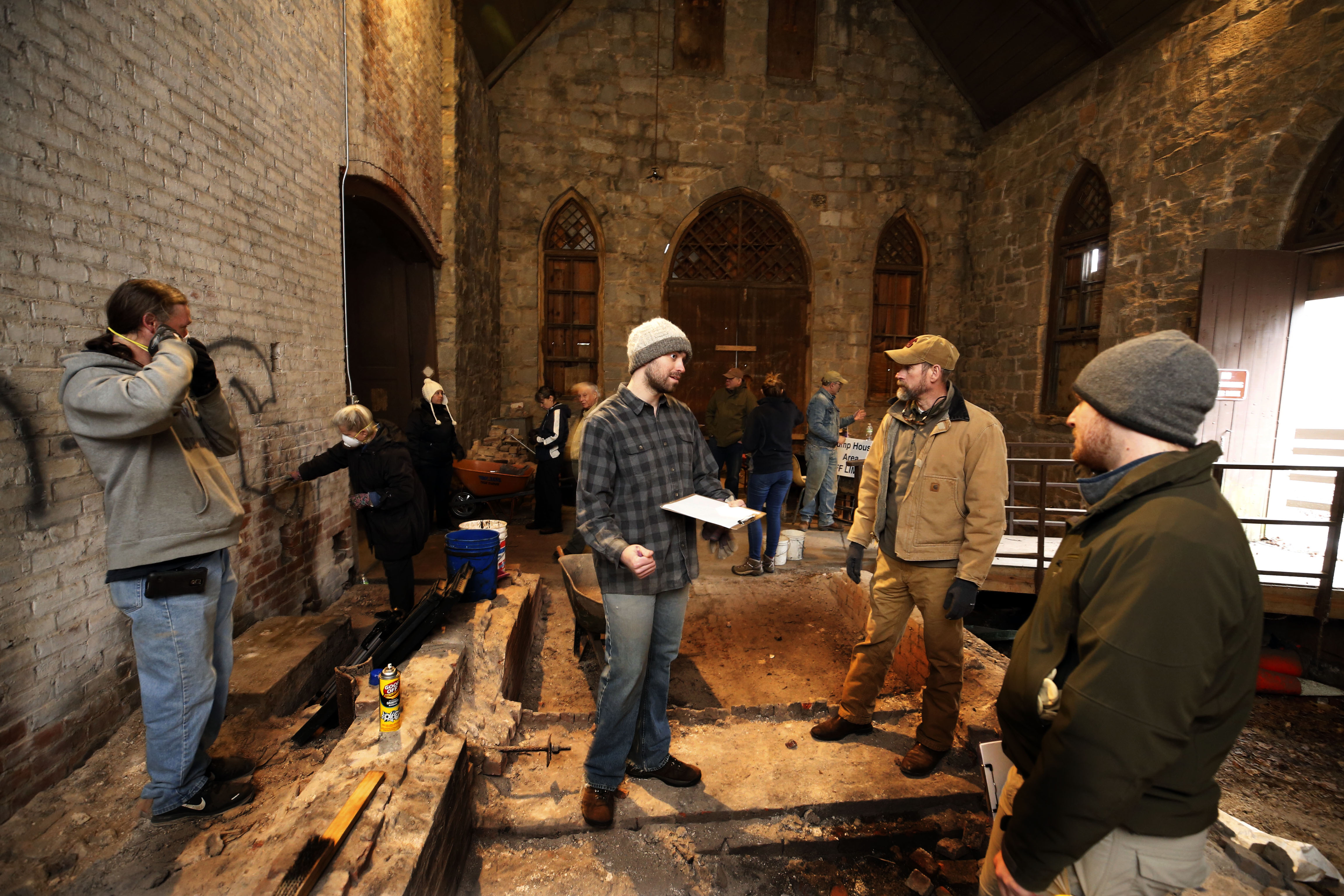 (Top) Joseph Costello, president of Friends of the Pump House and a 2017 graduate of the Wilder School's Master of Urban and Regional Planning program, coordinates volunteers at a recent cleanup. (Middle) The Pump House is a grand example of Gothic Revival architecture. (Bottom) Lyn Lanier, 